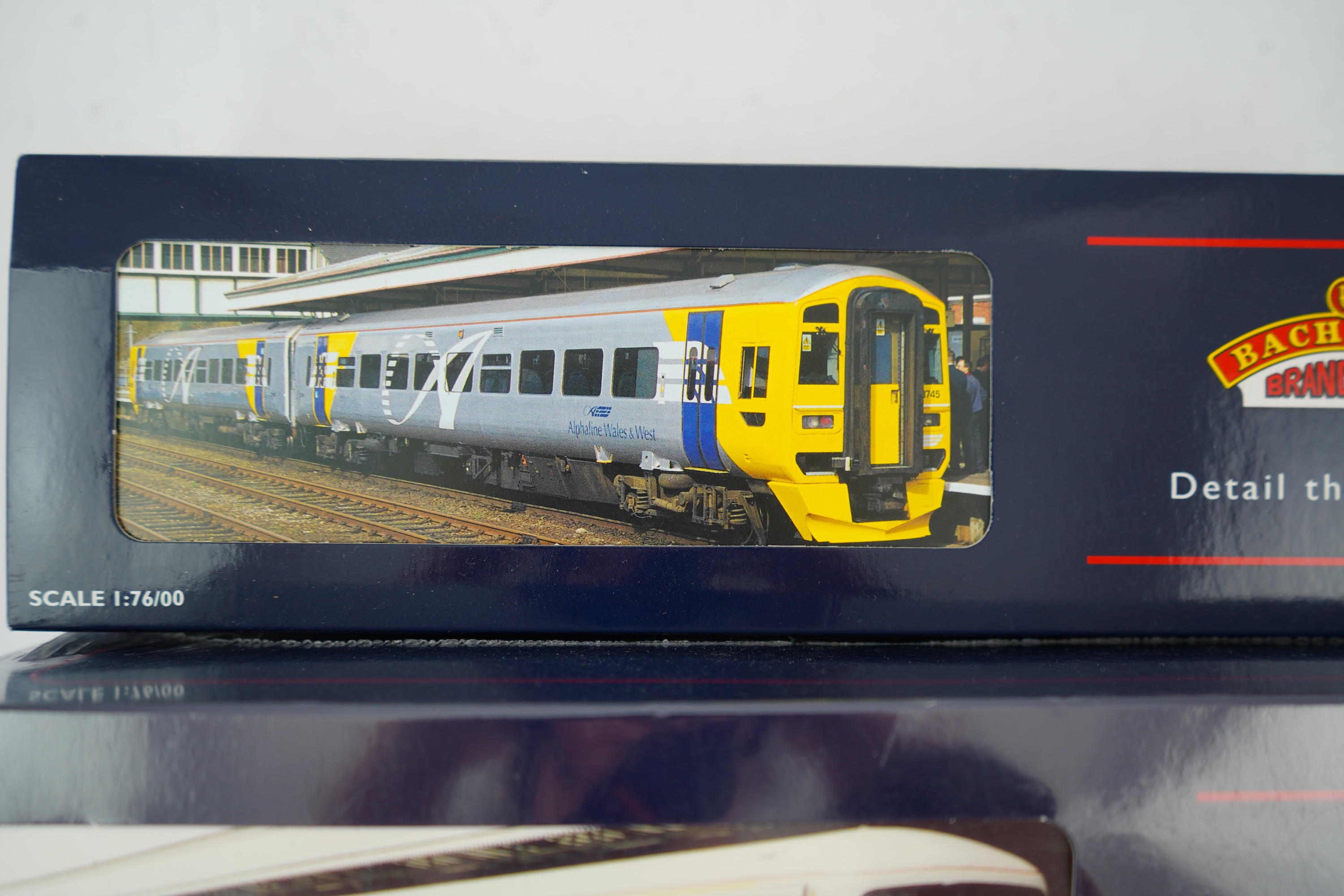 Three Bachmann Branchline 00 gauge railway DMU sets; 166 Turbo 3-car DMU, Thames Trains (31-026), 166 Turbo 3-car DMU, First Great Western/Link (31-027) and 158 2-car DMU, Wales and West (31-506)